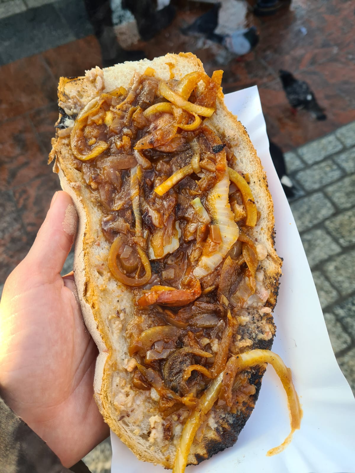 A JUICY looking sandwich. Imagine a hot dog with no sausage and the best onions ever. It looks DELICIOUS.