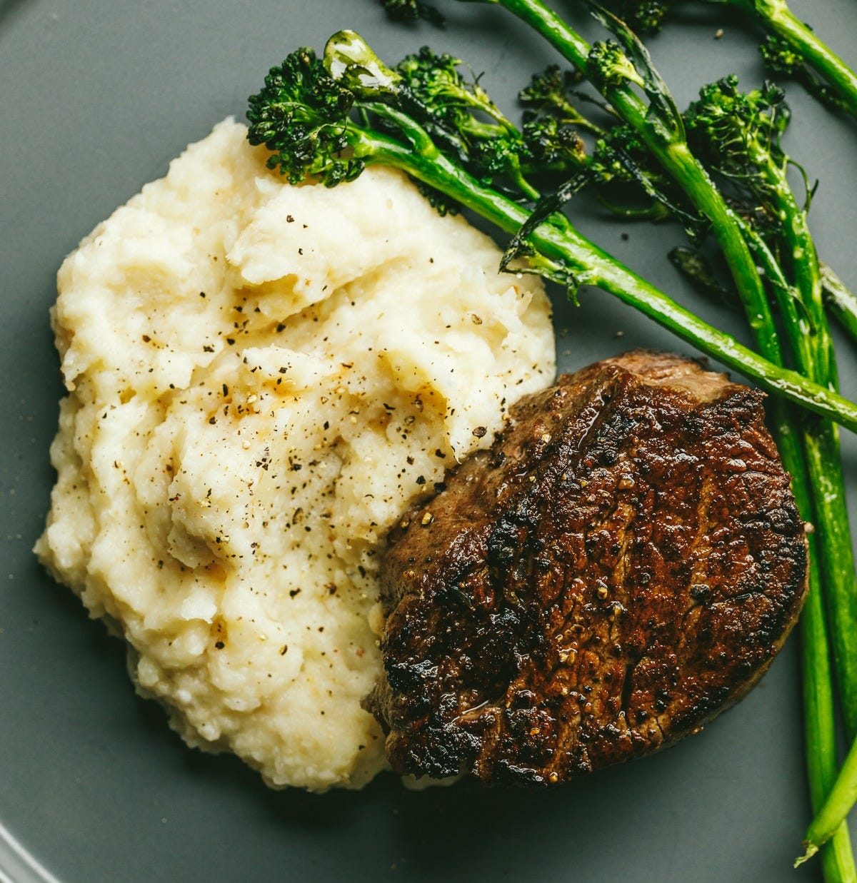 Reverse seared filet mignon with turnip. mash and broccolini.