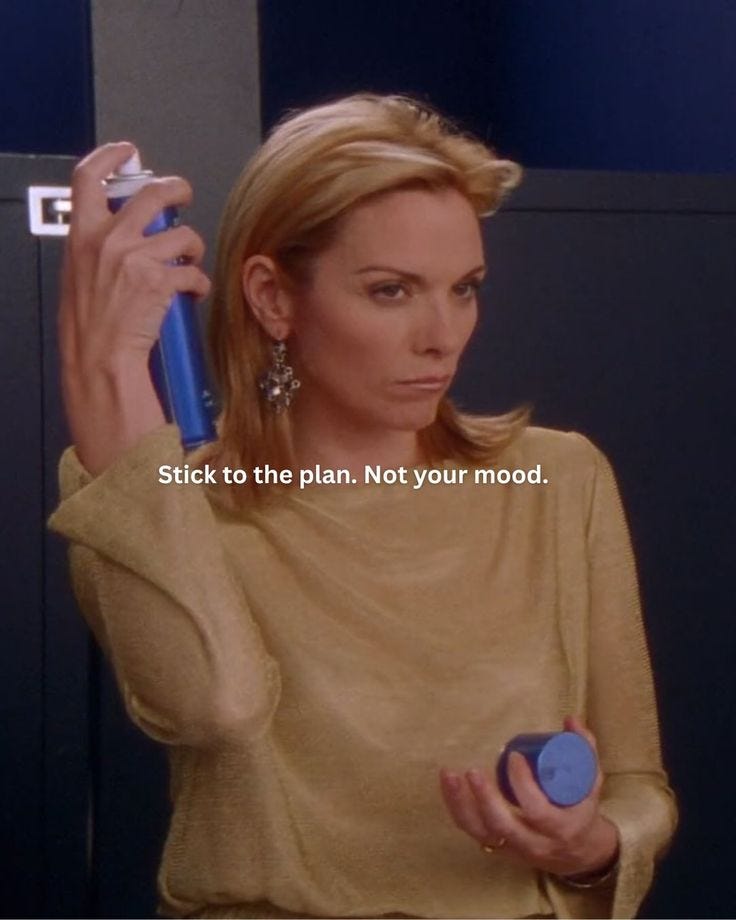 This may contain: a woman holding a blue object in her right hand and the caption says stick to the plan, not your mood