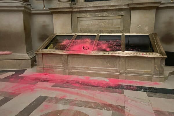 A red powder is spread across a protective case holding the U.S. Constitution as well as on the floor.
