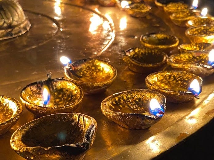 a bunch of candles that are on a table