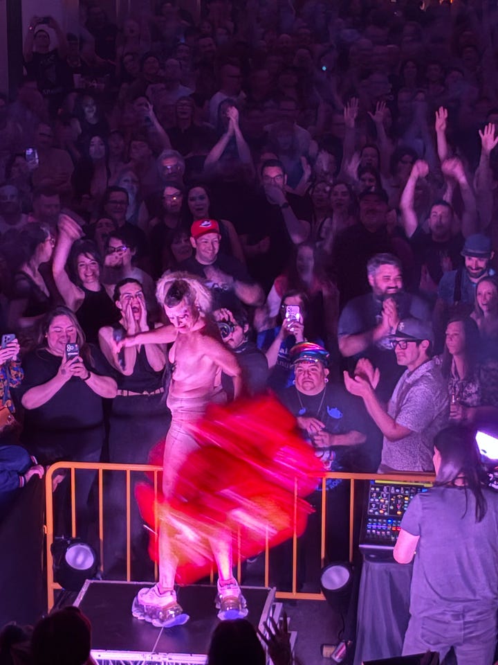 a crowd holding up a woman at La Rosa in Tucson