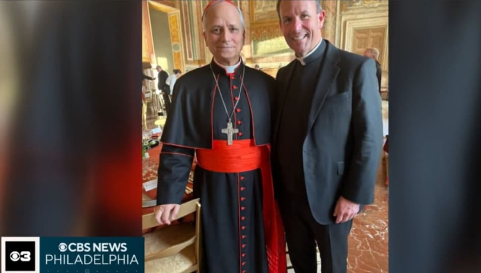 Father Kevin Gallagher pastor at St. Denis Church in Havertown, poses with the now Pope Leo XIV from a dinner last year.