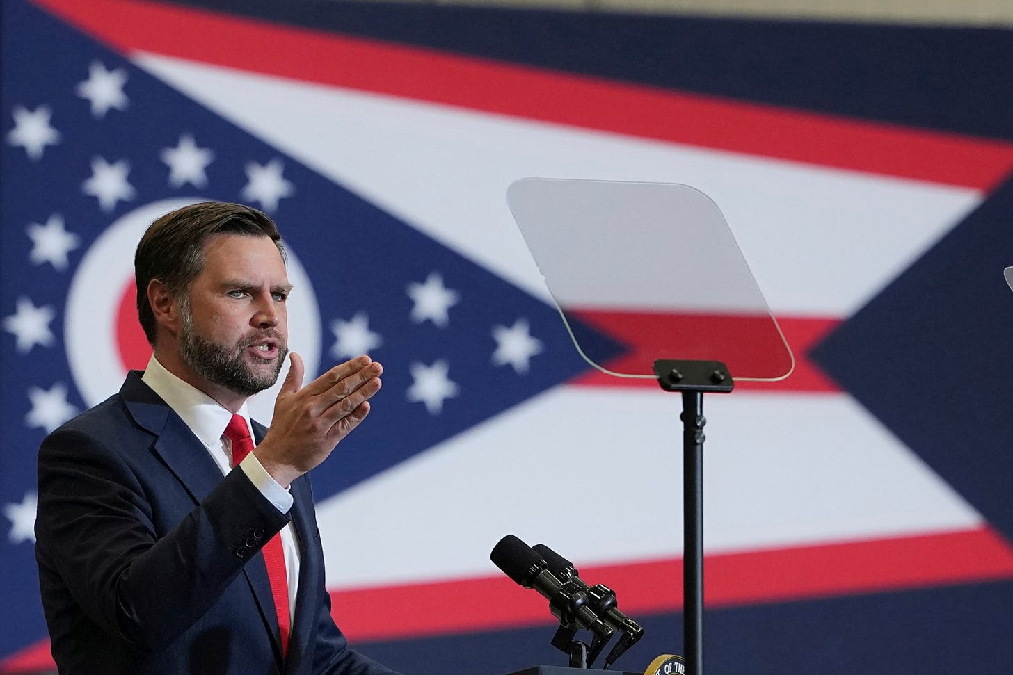 Vice President JD Vance speaks in front of an Ohio flag at a campaign rally in Sharonville, Ohio Vice President JD Vance speaks in front of an Ohio flag at a campaign rally in Sharonville, Ohio