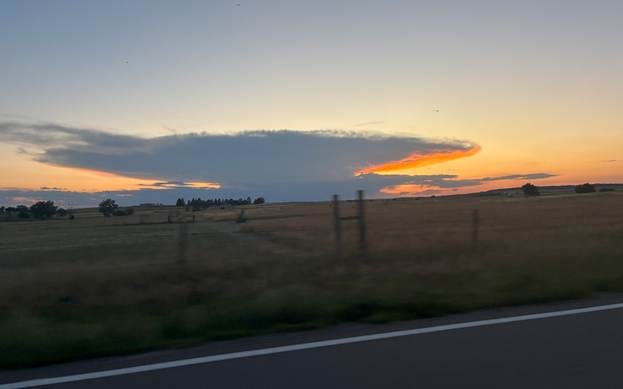 A field with a fence and a sunset

AI-generated content may be incorrect.