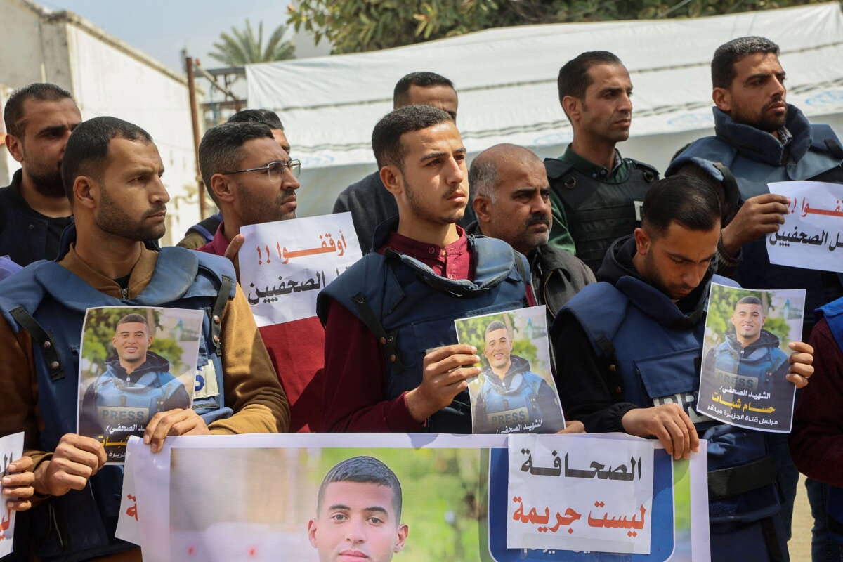 Palestinian journalists lift placards during a rally in protest of the killing of fellow reporters Hussam Shabat and Muhammad Mansour in Israeli strikes a day earlier, at the al-Ahli Arab hospital, also known as the Baptist hospital, in Gaza City on March 25, 2025. Palestinian journalists lift placards during a rally in protest of the killing of fellow reporters Hussam Shabat and Muhammad Mansour in Israeli strikes a day earlier, at the al-Ahli Arab hospital, also known as the Baptist hospital, in Gaza City on March 25, 2025.