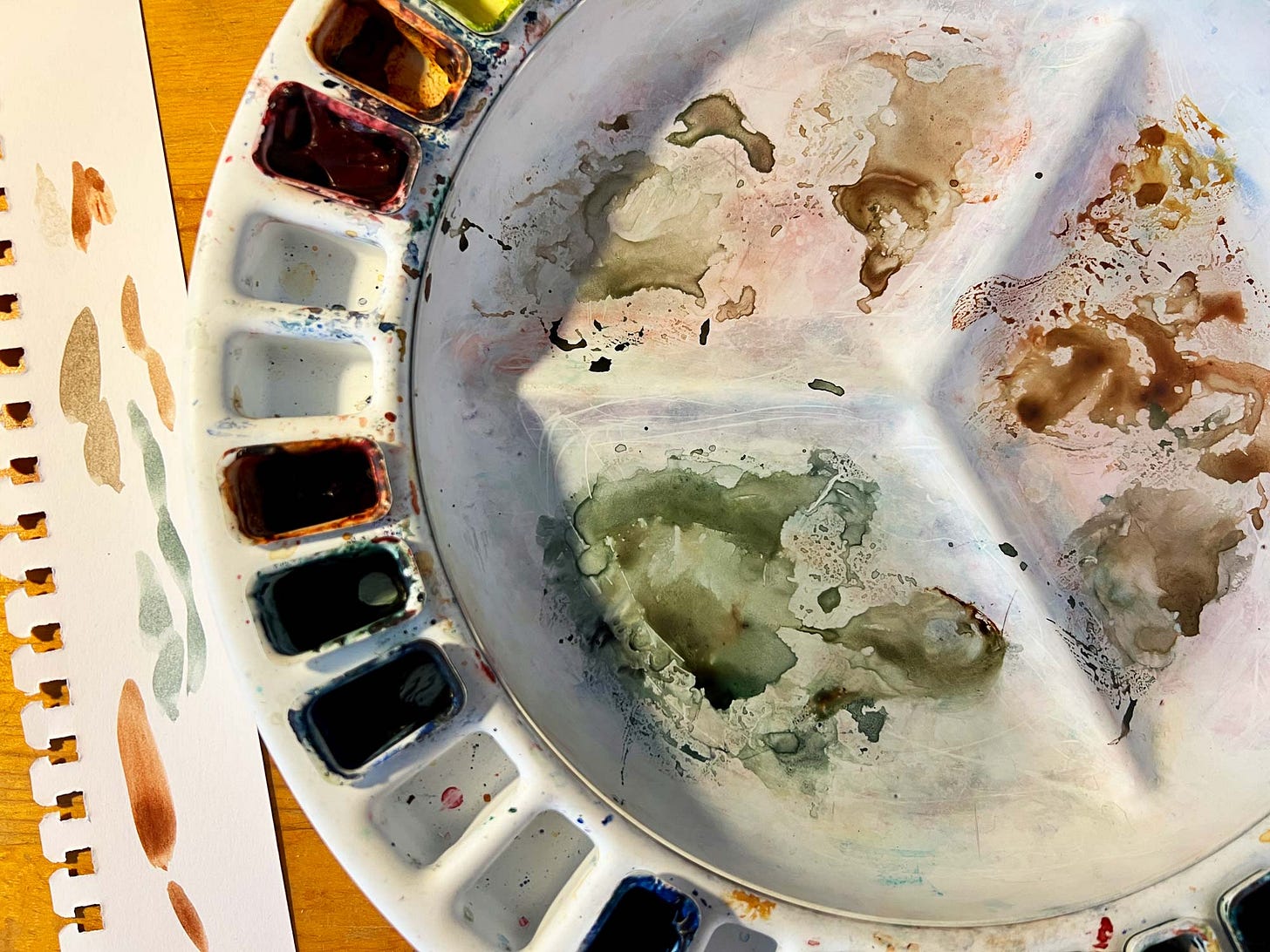 Photograph of K. Woodman-Maynard’s watercolor palette. Photograph of K. Woodman-Maynard’s watercolor palette.