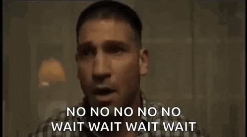 a man in a plaid shirt is standing in a dark room and says no no no no wait wait wait wait . a man in a plaid shirt is standing in a dark room and says no no no no wait wait wait wait .