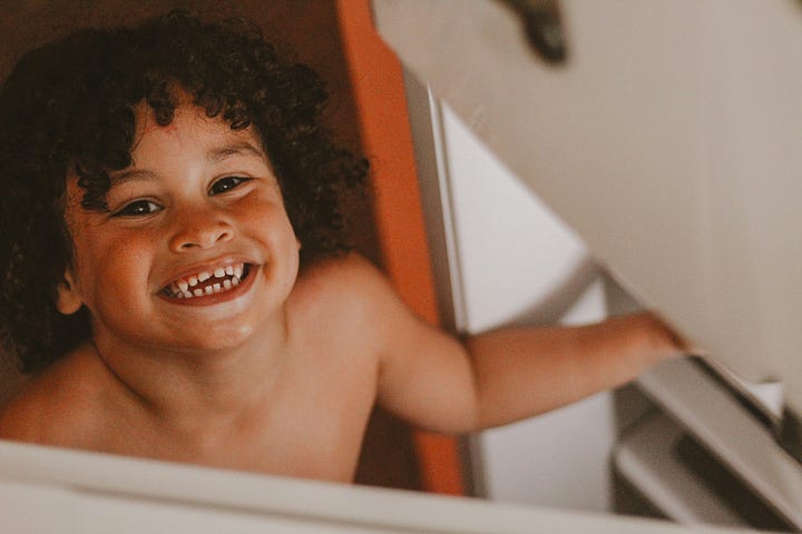 Kid looking in the fridge. Chef plating veggies. Photos by Igor Rodrigues and John Forander via Unsplash.