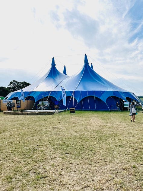 Scenes from Groundswell including the Big Top events tent, a snippet from the written programme and a speakers on stage.