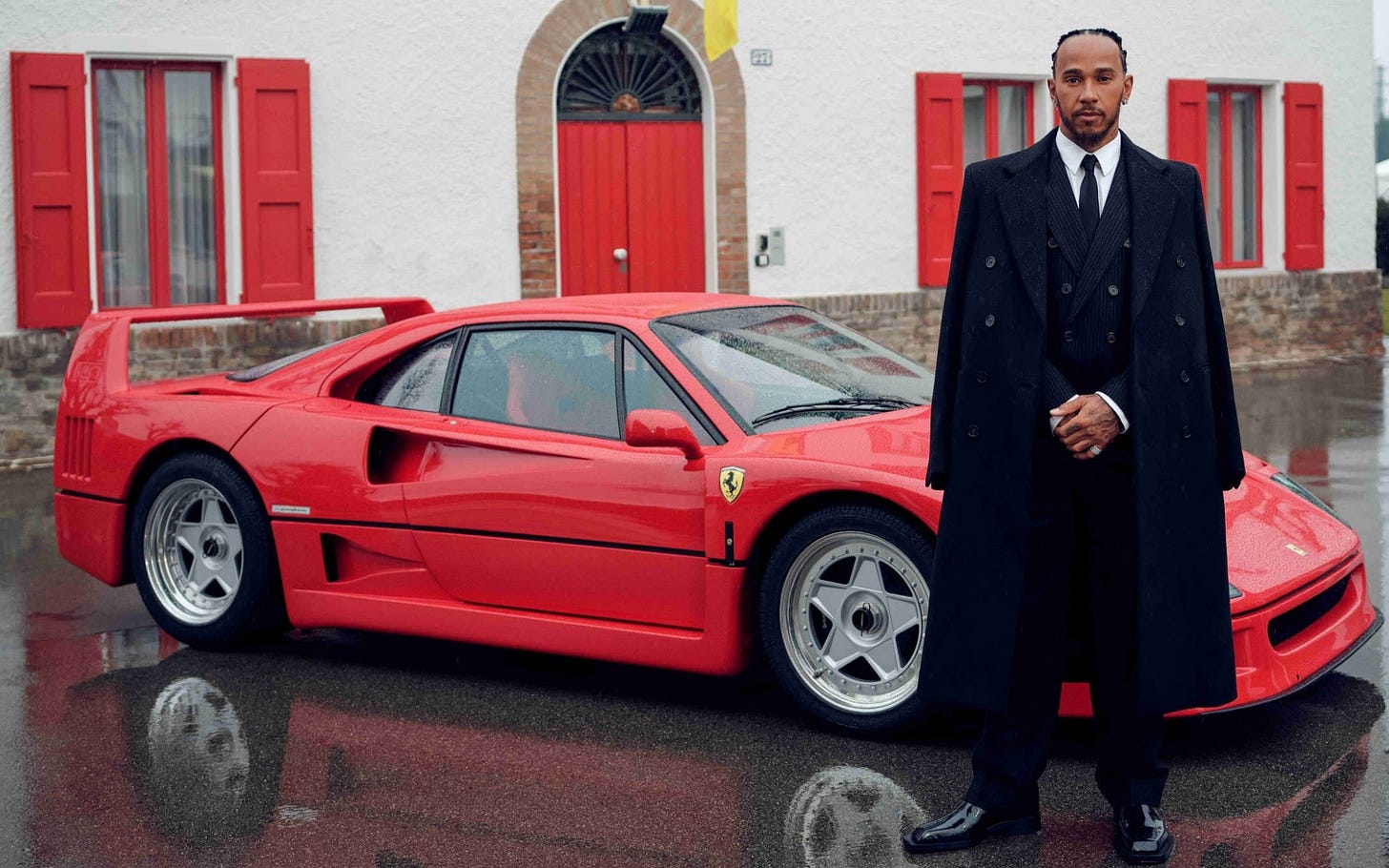 Lewis Hamilton poses in a Mafia don outfit next to an F40 Ferrari Lewis Hamilton poses in a Mafia don outfit next to an F40 Ferrari