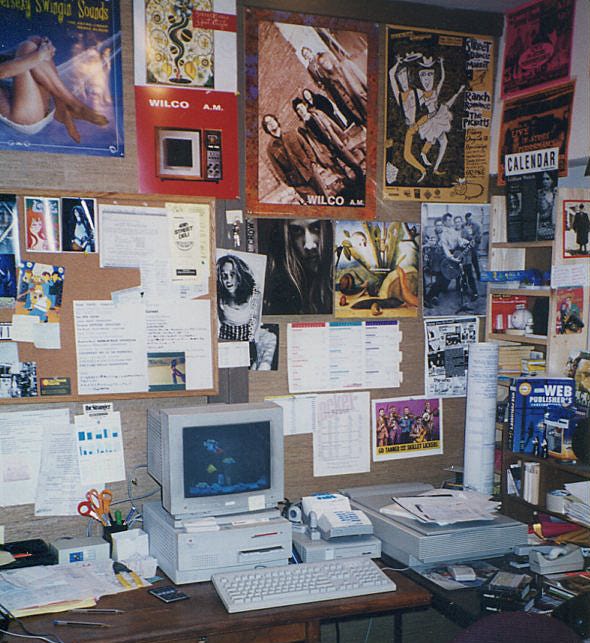 A desk with posters and a computer

AI-generated content may be incorrect.