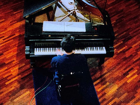Still images from Tokyo Melody: Sakamoto playing piano, images of Tokyo subway system, street crossing, and utility workers.