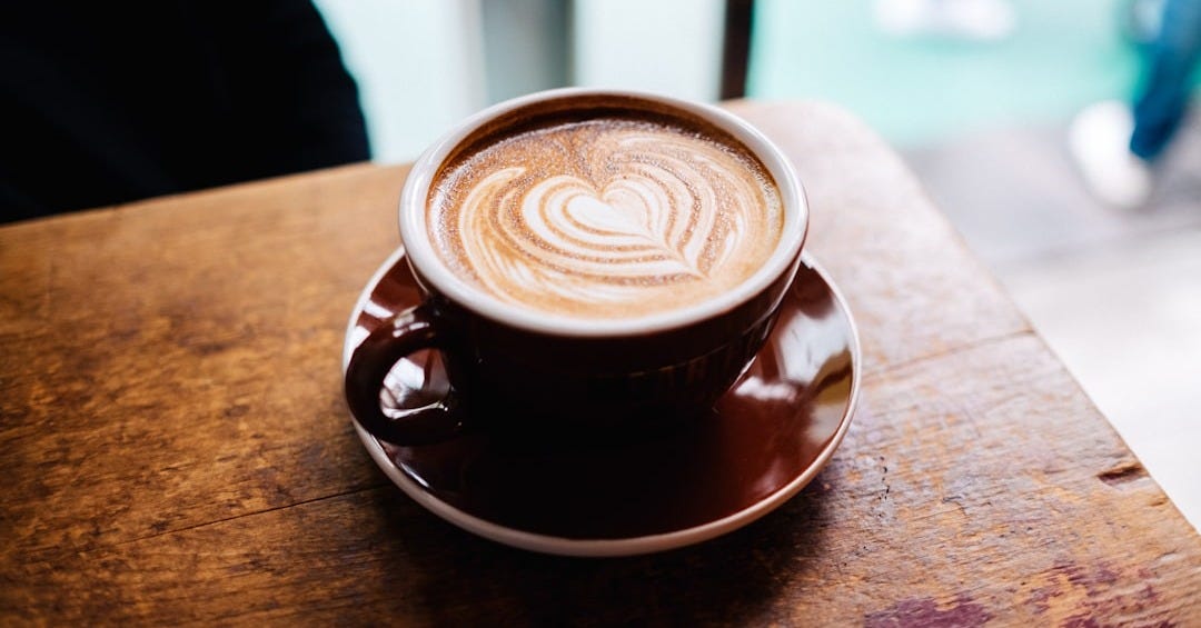 latte art in brown cup in macro photography latte art in brown cup in macro photography