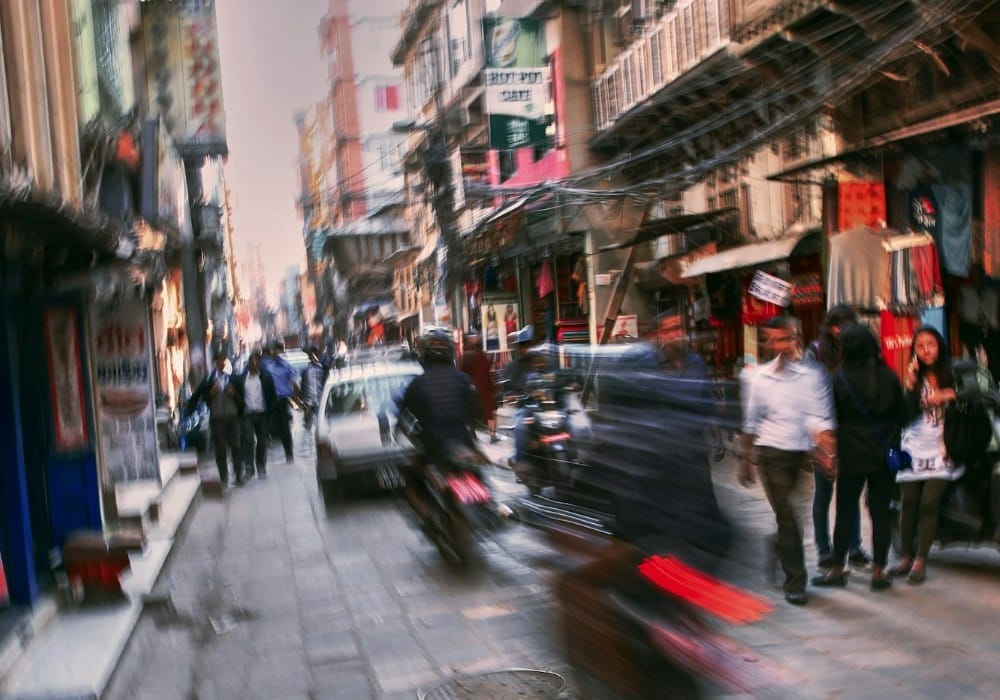 Motorcyclists speeding through a densely packed Vietnamese street Motorcyclists speeding through a densely packed Vietnamese street