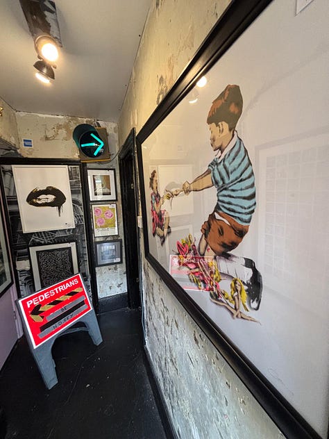 From a quiet street in Deal to the narrow hallway and intimate rooms beyond, the Walk Don't Walk Gallery invites visitors to step inside, be nosey, and discover an art space where humour, conversation and curiosity shape the experience as much as the works on the walls. — © Kent Chronicles