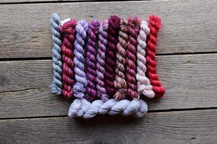 Koigu Sea Lavender Kentia Wrap Kit - Reds, Purples, Greys and main color of pale grey