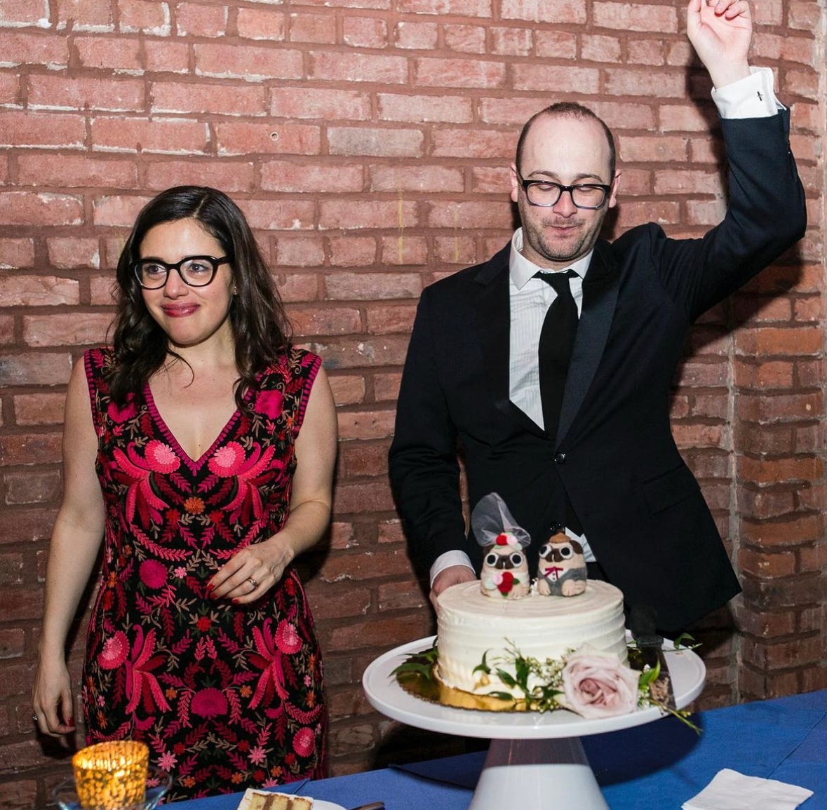 A picture from my wedding featuring a smaller-than-expected cake. A picture from my wedding featuring a smaller-than-expected cake.