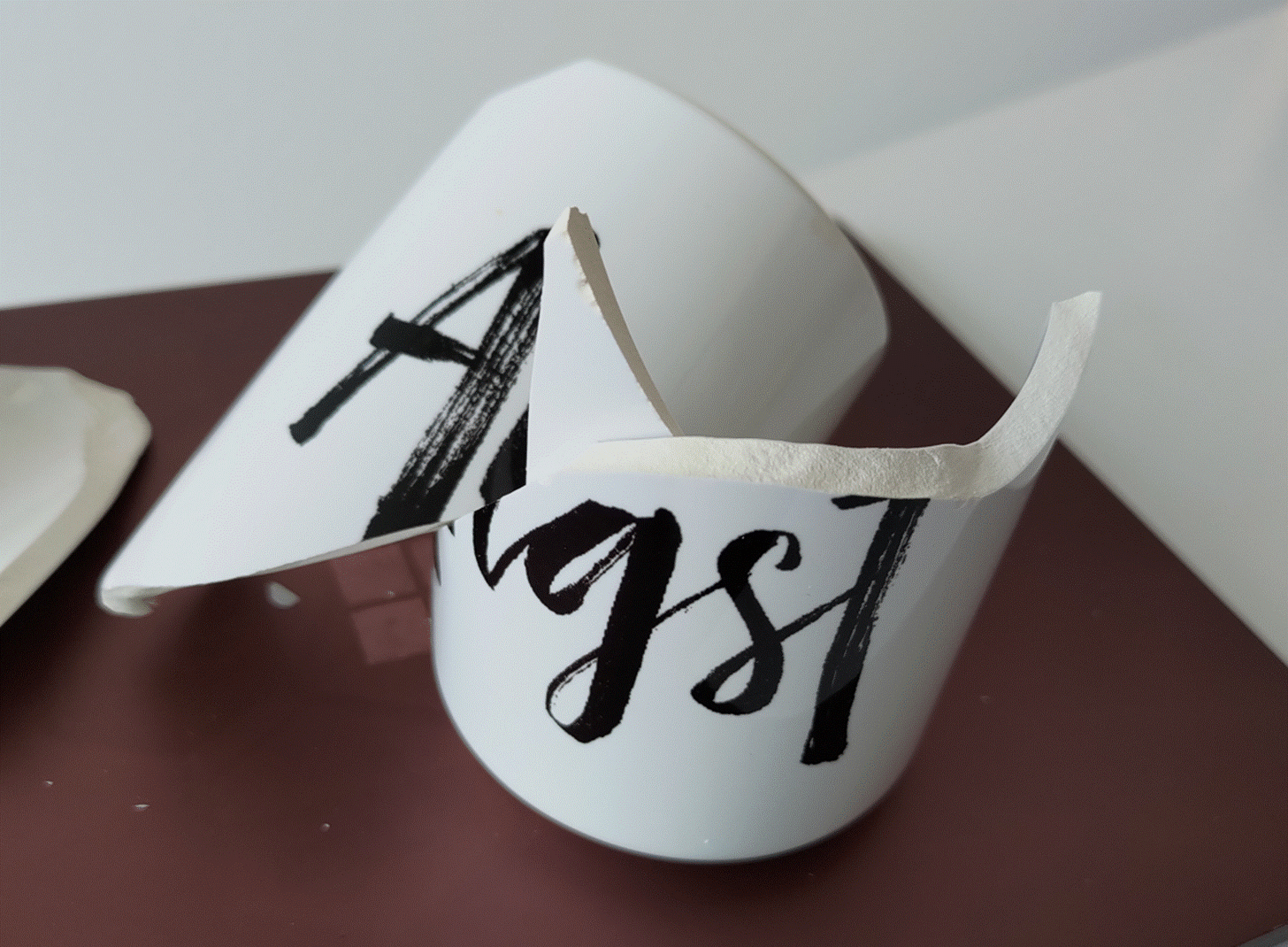 A white mug with black writing on it
Description automatically generated A white mug with black writing on it
Description automatically generated