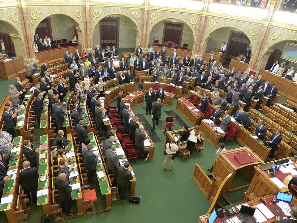 Hungarian MPs Tamás Pintér and Ákos Hadházy receive congratulations after their oath-taking ceremony in the Hungarian Parliament, September 2016