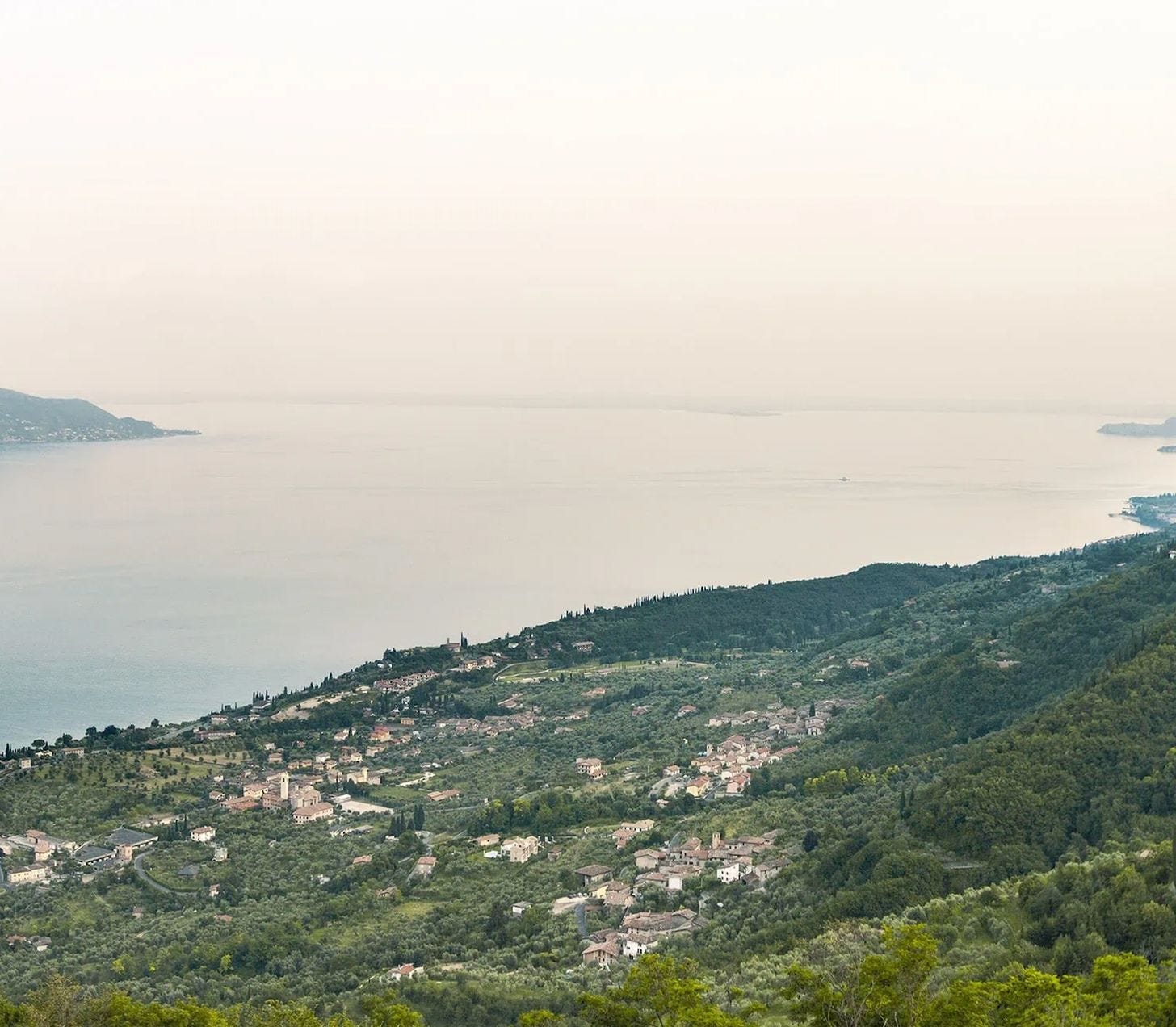 View of Lake Garda surrounded by mountains in northern Italy