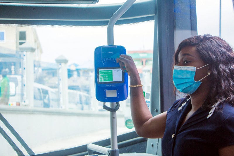 A commuter using Touch and Pay's Cowry card to pay for her bus fare. A commuter using Touch and Pay's Cowry card to pay for her bus fare.
