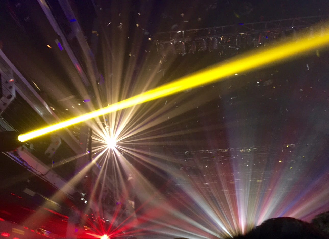 bright strobe lights at a large concert venue