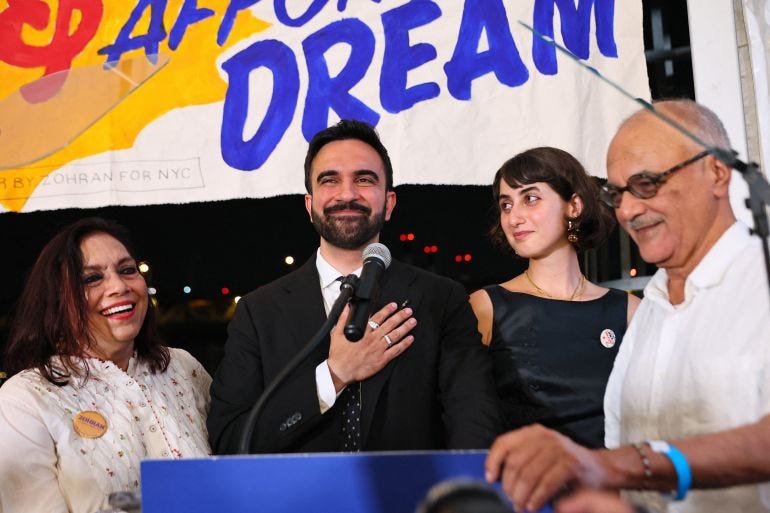 NEW YORK, NEW YORK - JUNE 24: (L-R) Mira Nair, New York mayoral candidate, State Rep. Zohran Mamdani (D-NY) Rama Duwaji and Mahmood Mamdani celebrate on stage during an election night gathering at The Greats of Craft LIC on June 24, 2025 in the Long Island City neighborhood of the Queens borough in New York City. Mamdani was announced as the winner of the Democratic nomination for mayor in a crowded field in the City’s mayoral primary to choose a successor to Mayor Eric Adams, who is running for re-election on an independent ticket. Michael M. Santiago/Getty Images/AFP (Photo by Michael M. Santiago / GETTY IMAGES NORTH AMERICA / Getty Images via AFP)