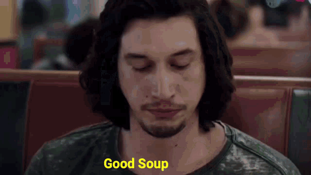 a man is sitting in a diner with his eyes closed and says good soup a man is sitting in a diner with his eyes closed and says good soup