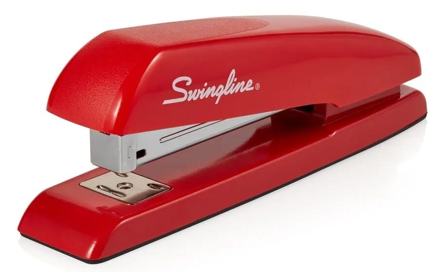 A red Swingline stapler, like the one Milton had in the movie Office Space.