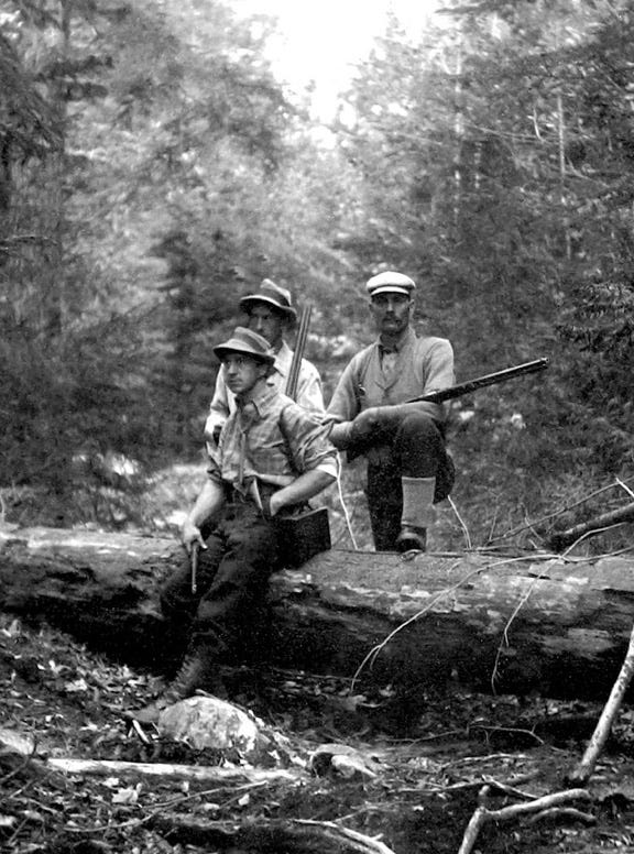 Building a canoe landing at Clifford Lake, Maine; Jack Howard, friend Leonard Small and Guide Bill in a portrait