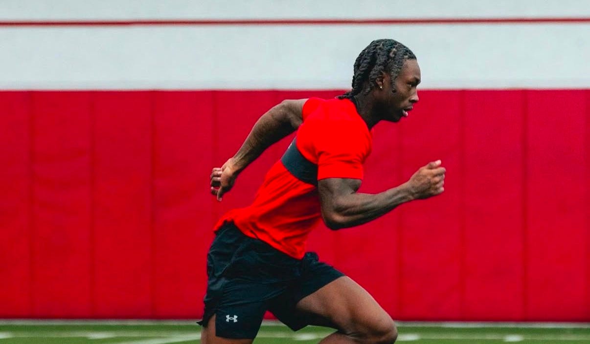 Wisconsin Badgers cornerback Eric Fletcher Jr. running on a practice field during winter conditioning. Wisconsin Badgers cornerback Eric Fletcher Jr. running on a practice field during winter conditioning.