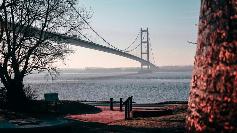 Unsplash photo of the Humber Bridge on a clear day, showing the full length of it.