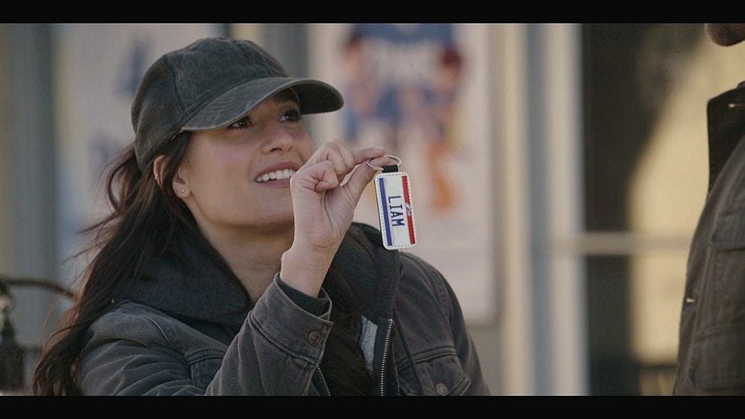 Cassie gets LIam a dog tag gift at an animal charity auction. Cassie gets LIam a dog tag gift at an animal charity auction.