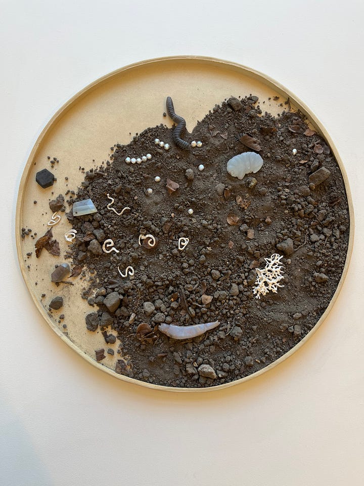 1. Stefanie Ying Lin Cheng -- Under the city / amulets of recycled metals, soil, clay and Scottish rocks; 2. Stevi Benson -- Interwoven / hand-cut paper