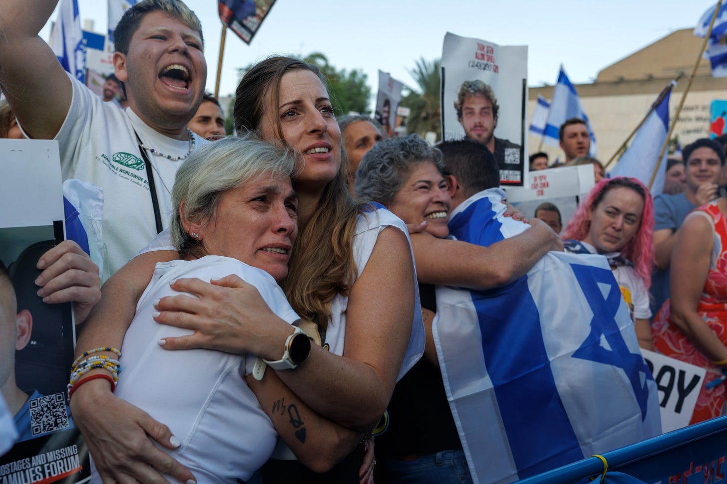 Israelis react as they watch the release of Israeli hostages by Hamas during a live broadcast on so-called hostages square in Tel Aviv, Israel, on Monday, Oct. 13, 2025. Hamas freed seven living Israeli hostages from the Gaza Strip on Monday morning, following a US-led deal reached late last week. Photographer: Kobi Wolf&#x2F;Bloomberg