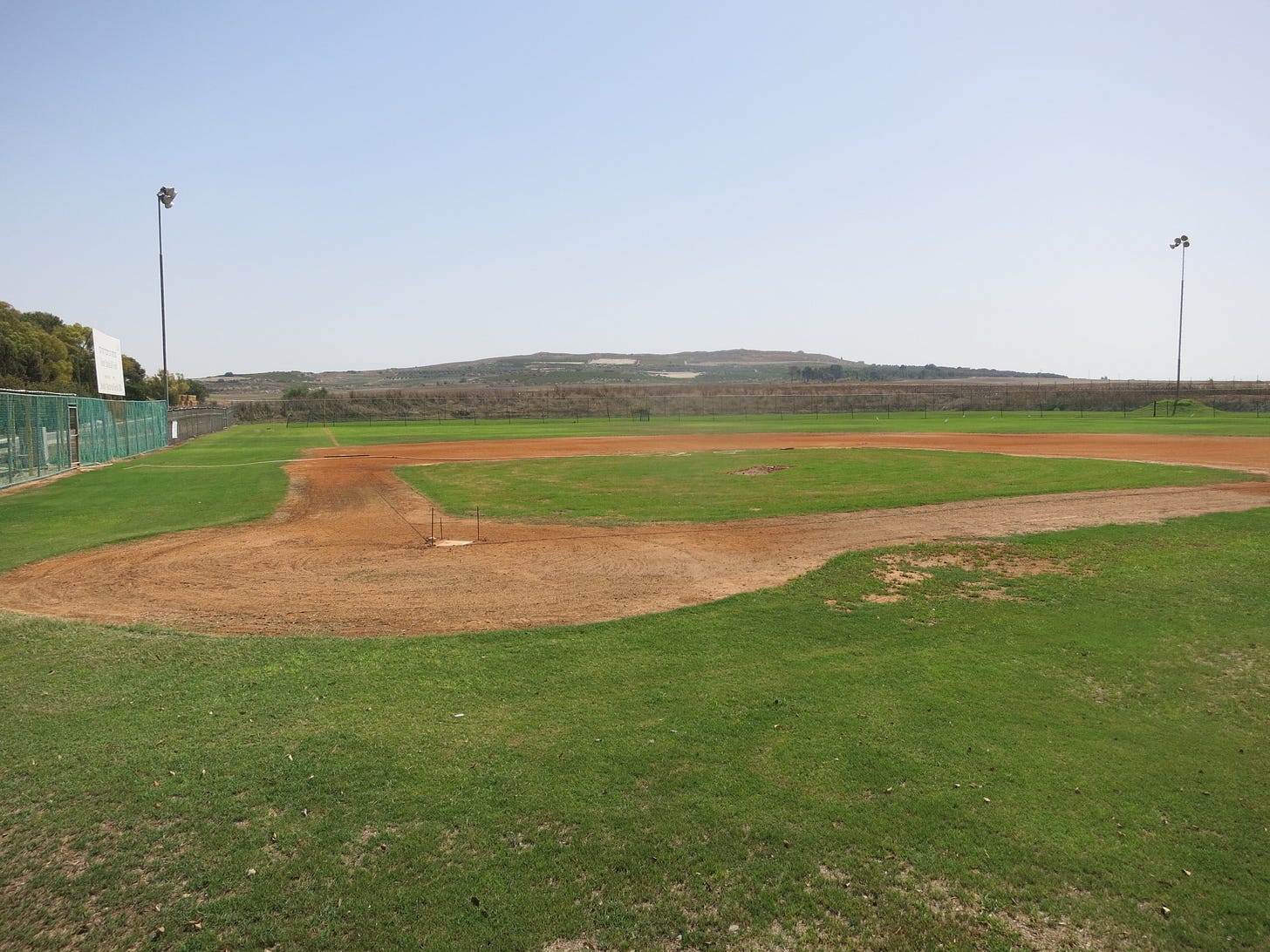 The field at Kibbutz Gezer.  Behind the left field fence are remains of King Solomon's Temple.