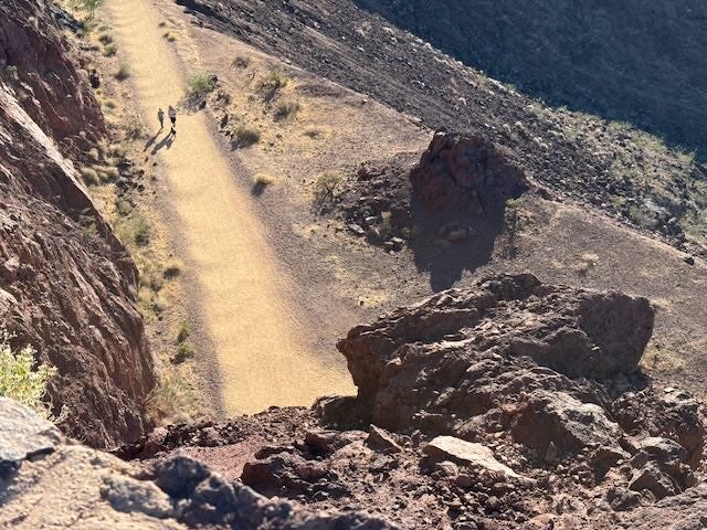 Overhead photo of hikers in the desert. Overhead photo of hikers in the desert.