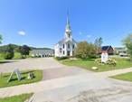 A white church with a steeple

AI-generated content may be incorrect.