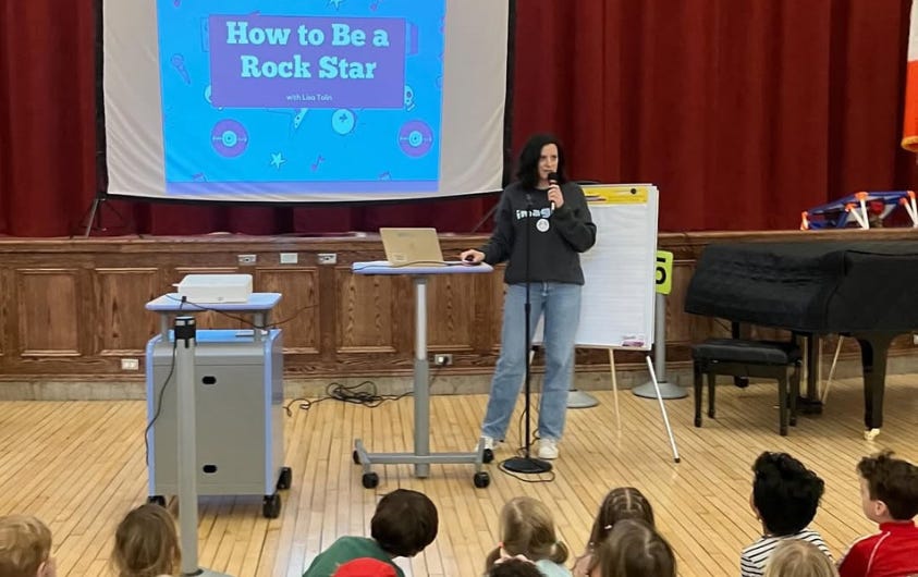 Lisa Tolin gives a school presentation