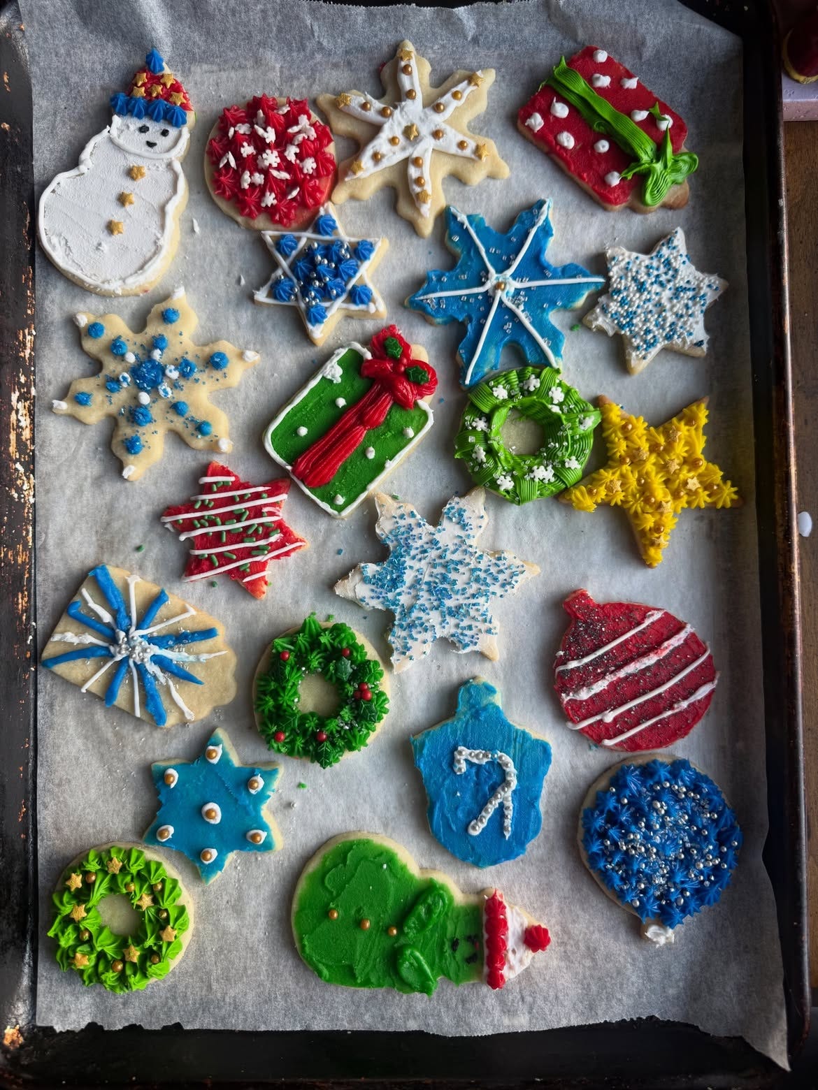 a tray of colorful holiday cookies decorated for Christmas and Hanukkah