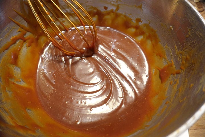 Watching the sugar melt before stirring in cream, butter, tahini, rose water, and a sprinkle of flaky sea salt.