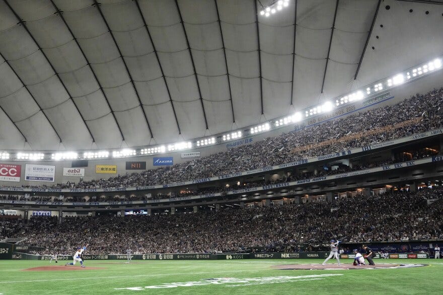 Chicago Cubs starting pitcher Shota Imanaga, left, throws to Los Angeles Dodgers' Shohei Ohtani, right, in the first inning of an MLB Japan Series baseball game in the Tokyo Dome in Tokyo, Japan, Tuesday, March 18, 2025. (AP Photo/Eugene Hoshiko) Chicago Cubs starting pitcher Shota Imanaga, left, throws to Los Angeles Dodgers' Shohei Ohtani, right, in the first inning of an MLB Japan Series baseball game in the Tokyo Dome in Tokyo, Japan, Tuesday, March 18, 2025. (AP Photo/Eugene Hoshiko)