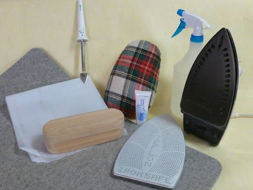 pressing principles for quilting with a clapper, a wool pressing mat, starch, an ironing cloth