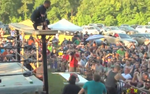 [Screenshot: Moore about to dive off wooden scaffold]