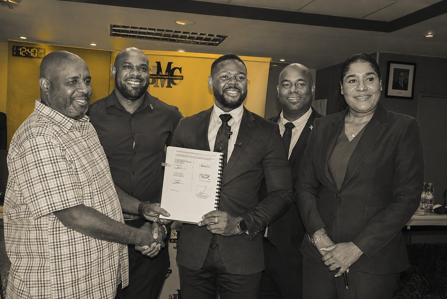 Mayor of Montego Bay Richard Vernon (centre) and Omar Thompson of Odel Allen Construction (left) shake hands following the signing of a contract for infrastructure work at Bogue Industrial Estate. Also in the photo are procurement officer at the St James Municipal Corporation Patrick Rhoden (second left); deputy mayor and councillor for the Spring Gardens Division Dwight Crawford; and the corporation’s chief executive officer Naudia Crosskill. Mayor of Montego Bay Richard Vernon (centre) and Omar Thompson of Odel Allen Construction (left) shake hands following the signing of a contract for infrastructure work at Bogue Industrial Estate. Also in the photo are procurement officer at the St James Municipal Corporation Patrick Rhoden (second left); deputy mayor and councillor for the Spring Gardens Division Dwight Crawford; and the corporation’s chief executive officer Naudia Crosskill.