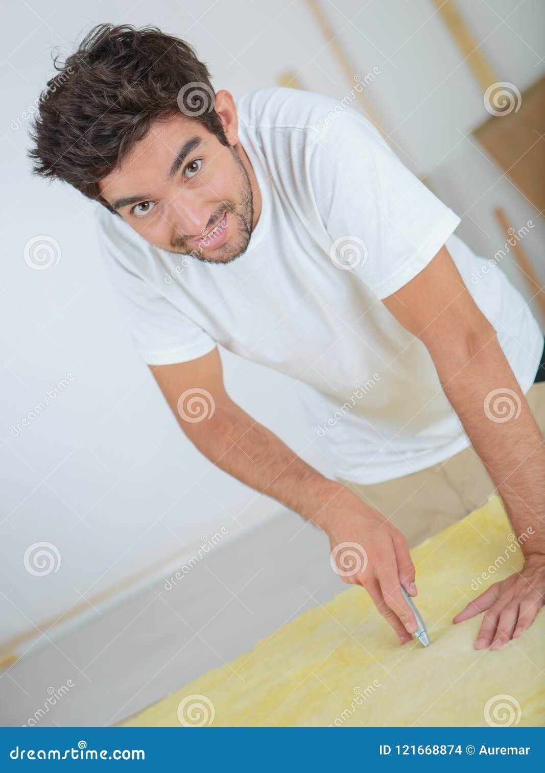 Man using stanley knife stock photo. Image of smile - 121668874
