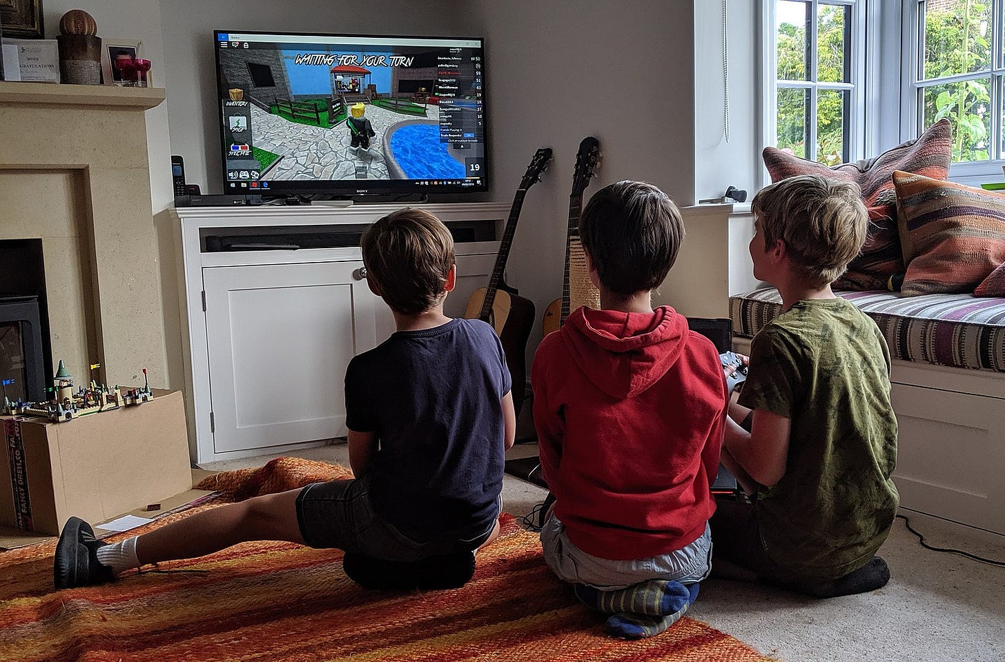 Three boys playing Roblox