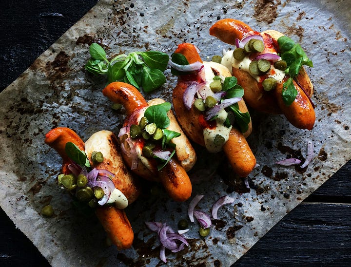 A sub sandwich and some beautiful hot dogs. Photos by Amy Tran and 'LikeMeat' via Unsplash.