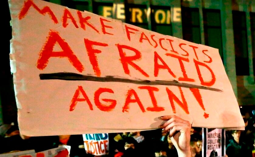 A protester holds a sign that reads "Make Fascists Afraid Again!" during a demonstration at the University of Washington on Jan. 20, 2017, in Seattle. A protester holds a sign that reads "Make Fascists Afraid Again!" during a demonstration at the University of Washington on Jan. 20, 2017, in Seattle.